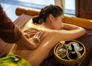 A Vietnamese woman is enjoying traditional Vietnamese massage.