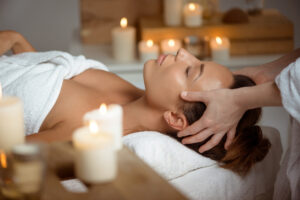 A woman is enjoying facial treatment.