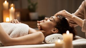 A woman is enjoying head massage.