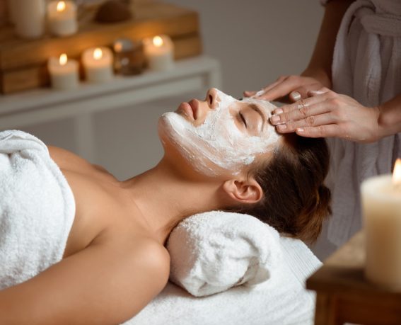 A woman is enjoying facial treatment.