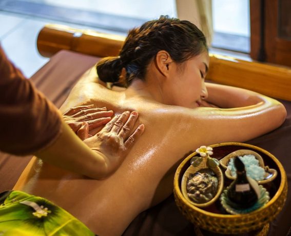 A Vietnamese woman is enjoying traditional Vietnamese massage.